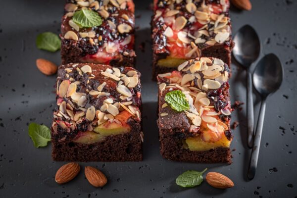 Tasty and sweet brownie with fresh fruits and almond.