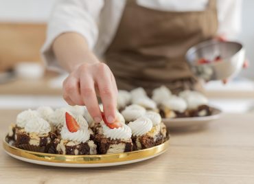 close-up-hand-holding-strawberry